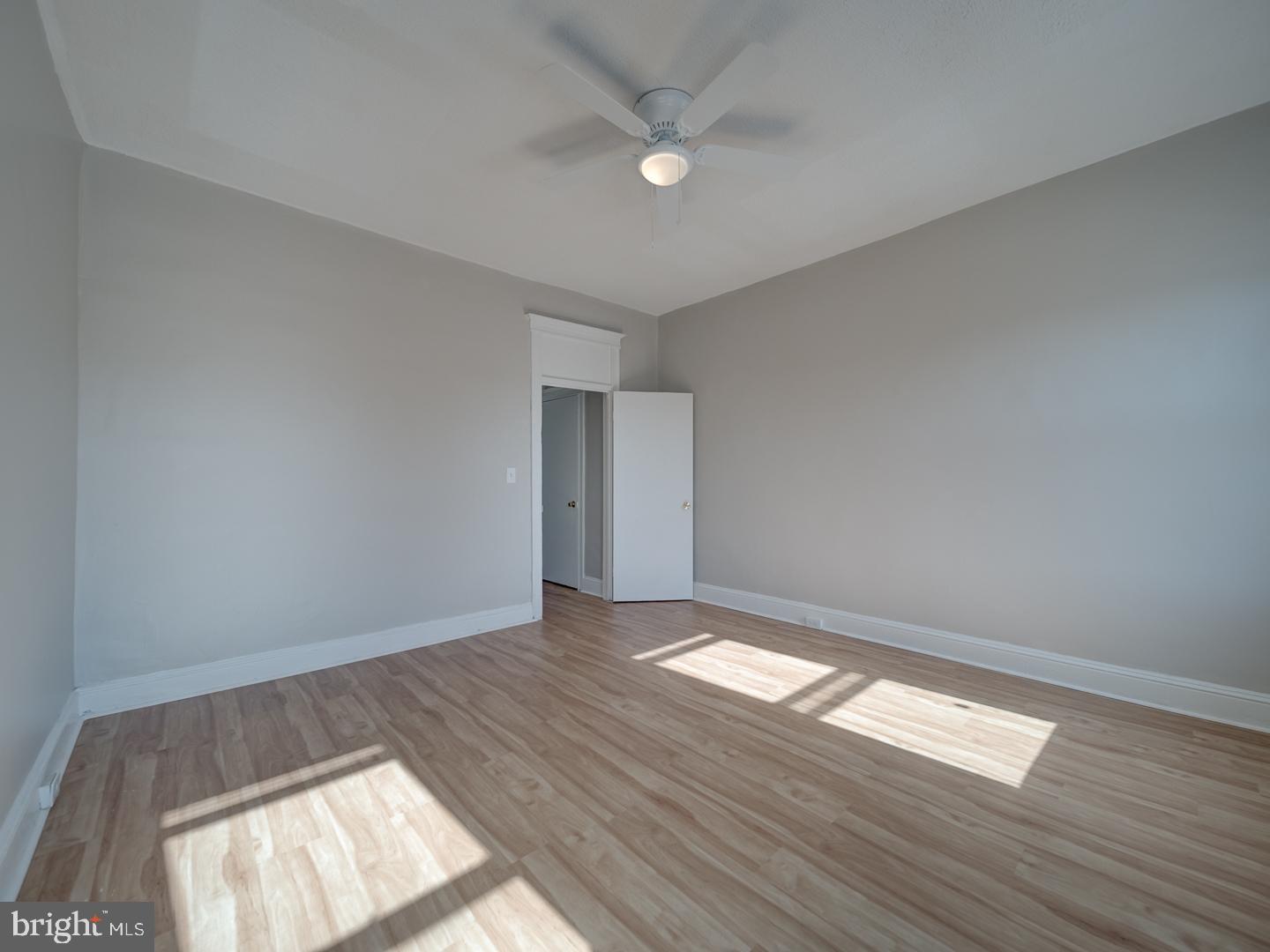 1716 Homestead Street Baltimore, MD 21218 - Photo 40 of 48 an empty room with wooden floor and windows