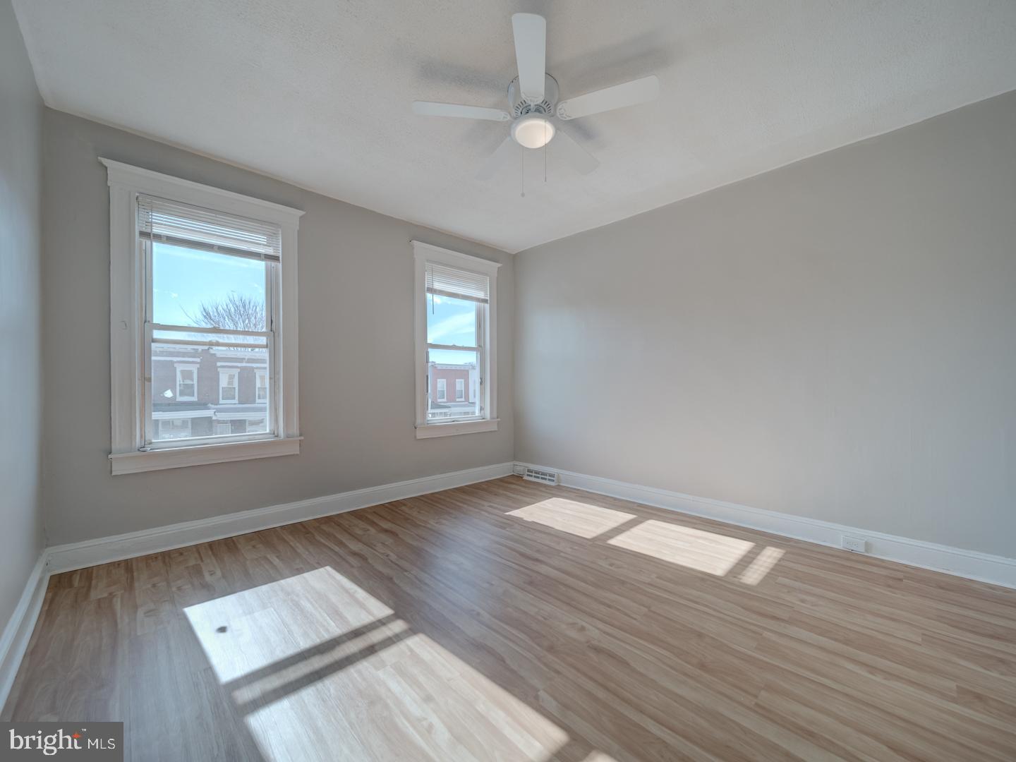 1716 Homestead Street Baltimore, MD 21218 - Photo 4 of 48 wooden floor in an empty room with a window