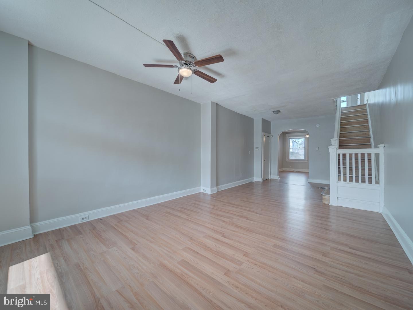 1716 Homestead Street Baltimore, MD 21218 - Photo 5 of 48 a view of an empty room with a window and wooden floor