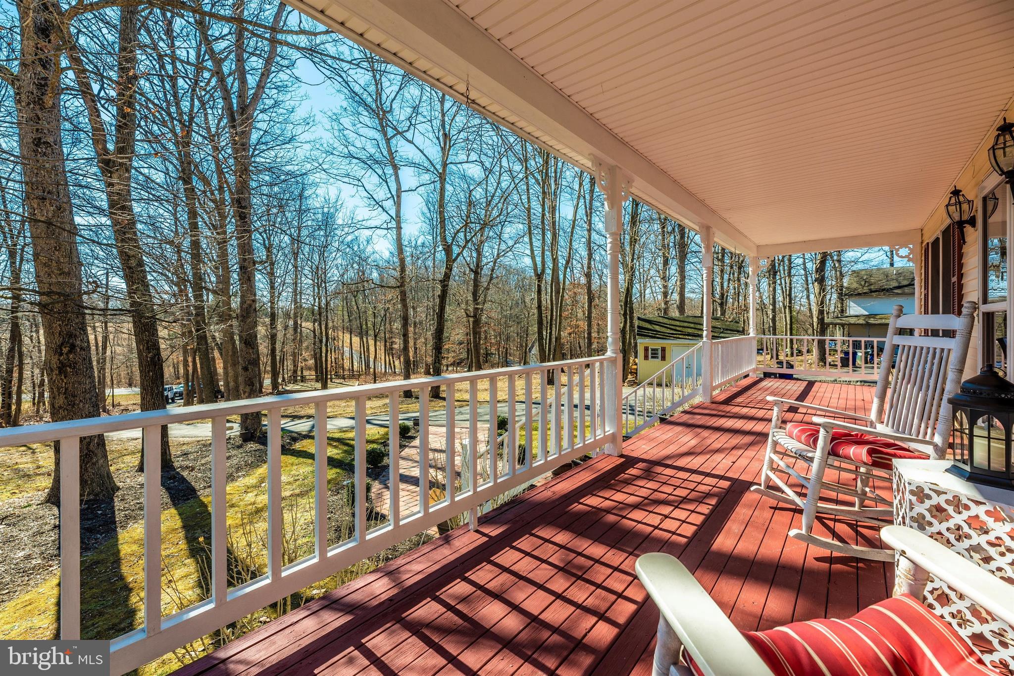 14112 Peddicord Road Mount Airy, MD 21771 - Photo 5 of 31 Porch is perfect to sit and enjoy the wooded view