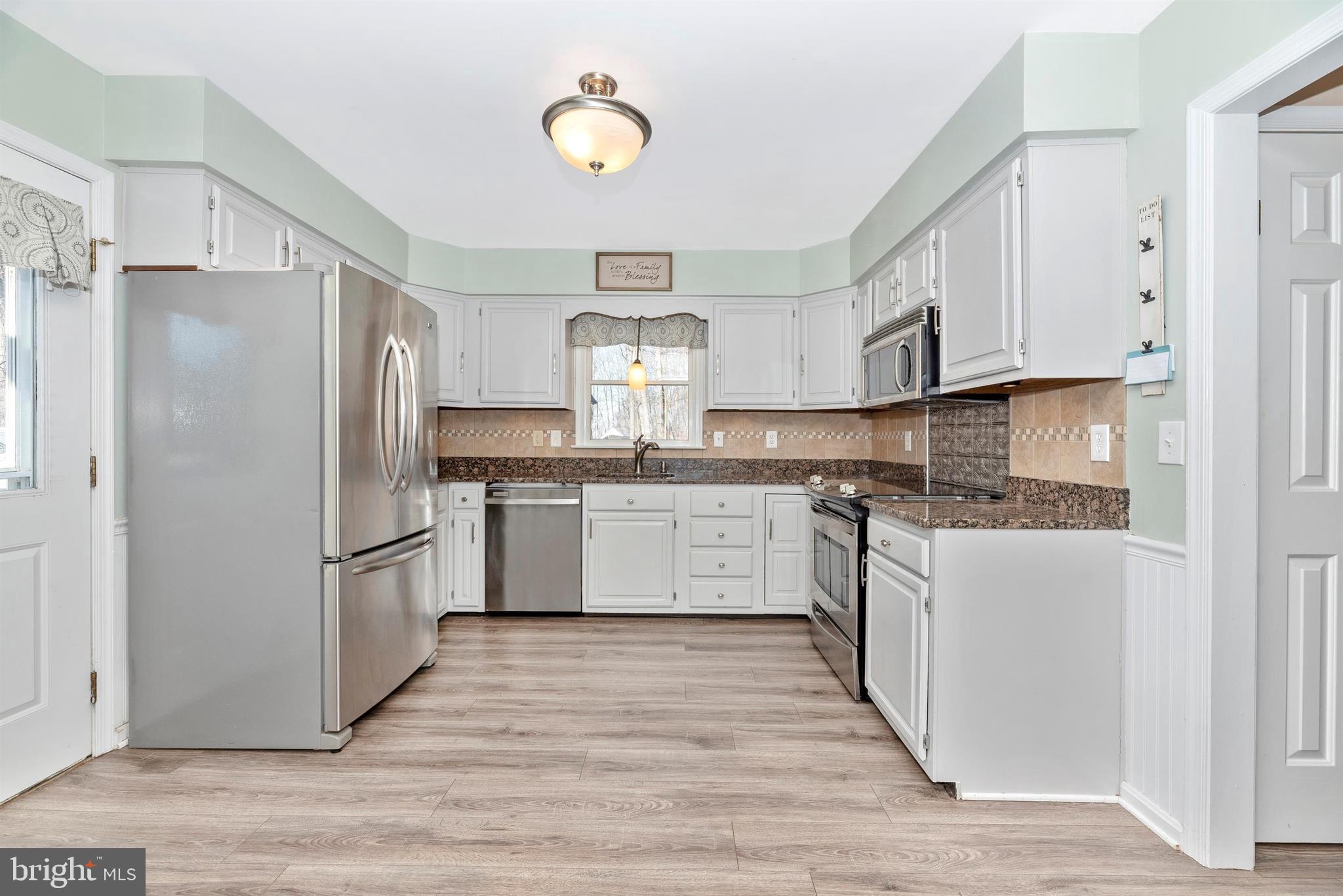14112 Peddicord Road Mount Airy, MD 21771 - Photo 9 of 31 Updated Kitchen with new floor and granite tops.