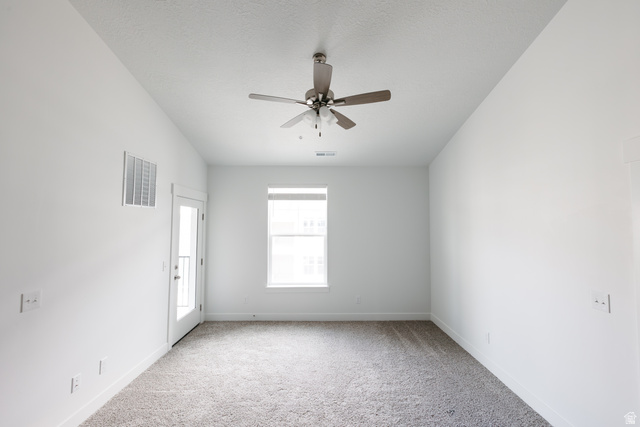4653 South Alder Drive, Unit H303 Mapleton, UT 84664 - Photo 3 of 15 Spare room featuring light carpet and ceiling fan
