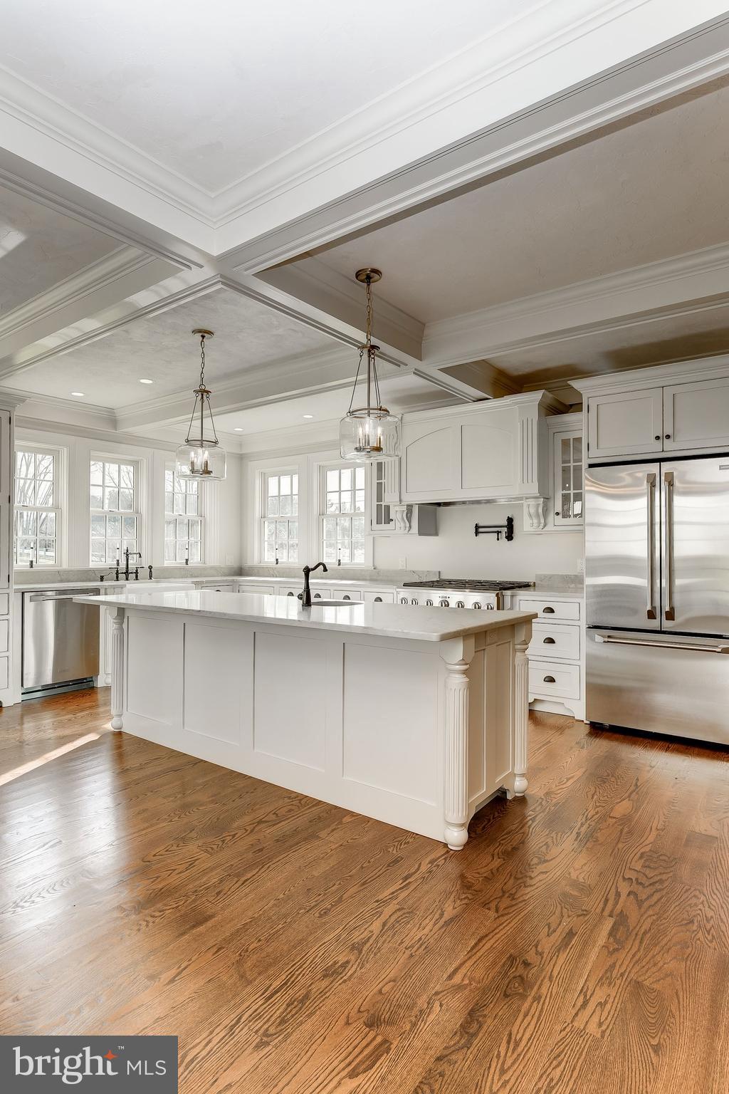 4204 Mt Carmel Road Upperco, MD 21155 - Photo 22 of 66 a large white kitchen with stainless steel appliances granite countertop a stove a sink dishwasher and a oven with cabinets