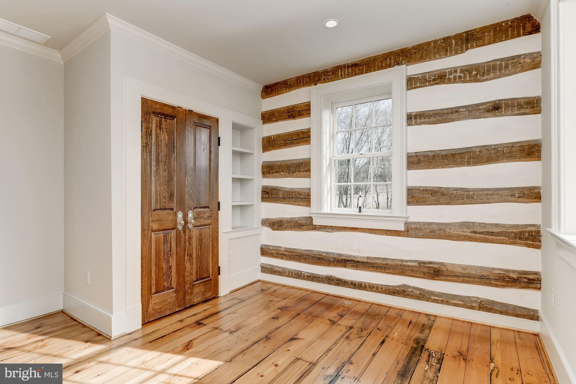 4204 Mt Carmel Road Upperco, MD 21155 - Photo 50 of 66 a view of a bedroom with wooden floor and windows