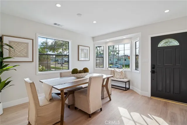 a living room with furniture potted plant and a window