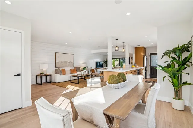 a kitchen with sink stove and cabinets