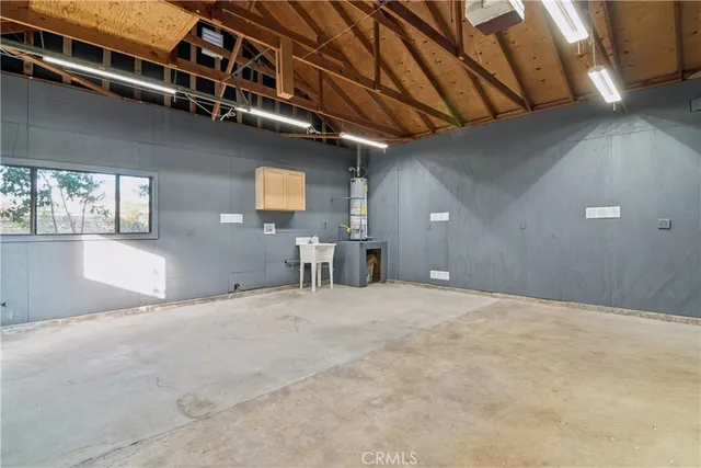 an aerial view of residential building with parking