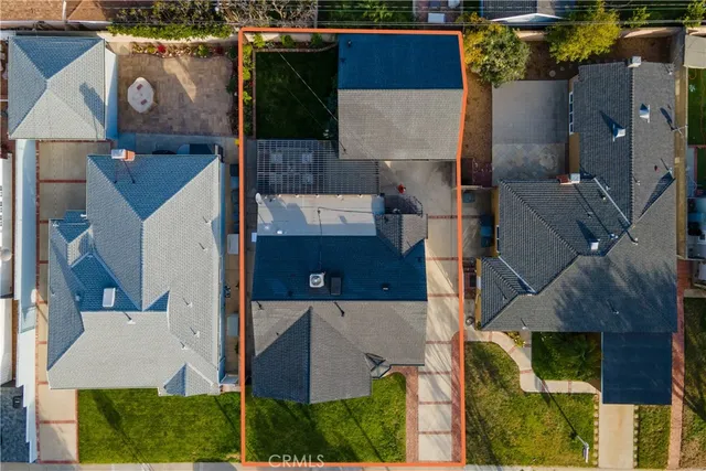 an aerial view of residential building with parking space
