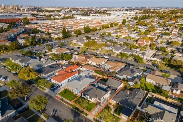 a view of a house with a backyard porch and sitting area