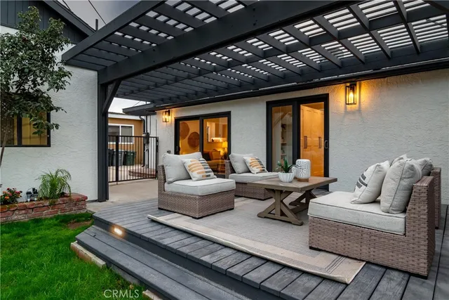 a front view of a house with a garden and plants