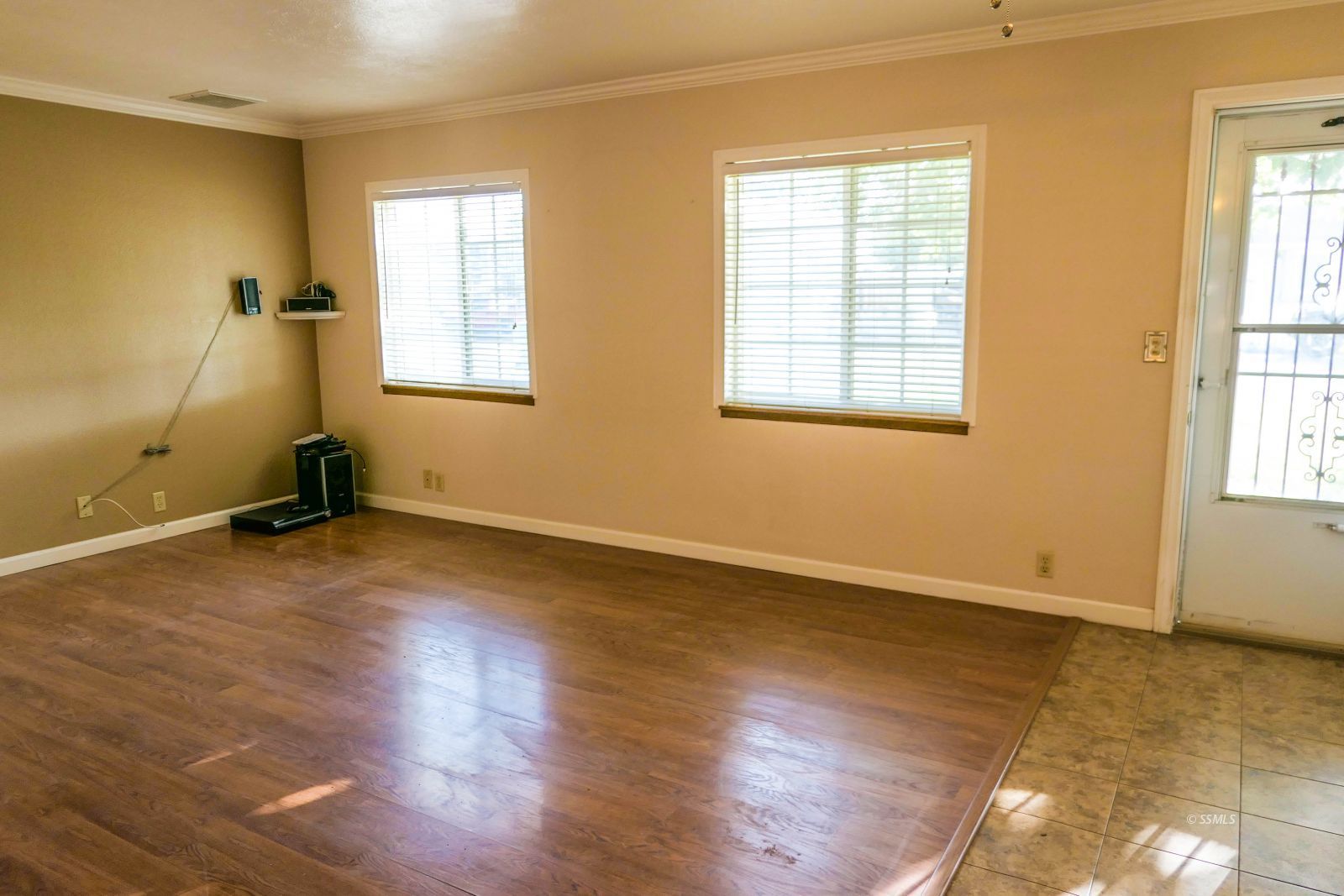 812 South Sunset Street Ridgecrest, CA 93555 - Photo 8 of 40 a view of room with wooden floor and windows