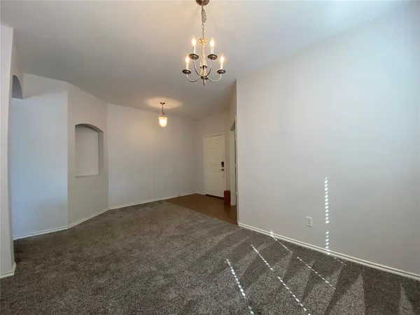 a view of a chandelier in an empty room