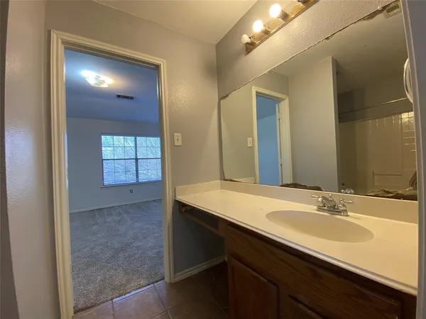 a bathroom with a sink double vanity and a mirror