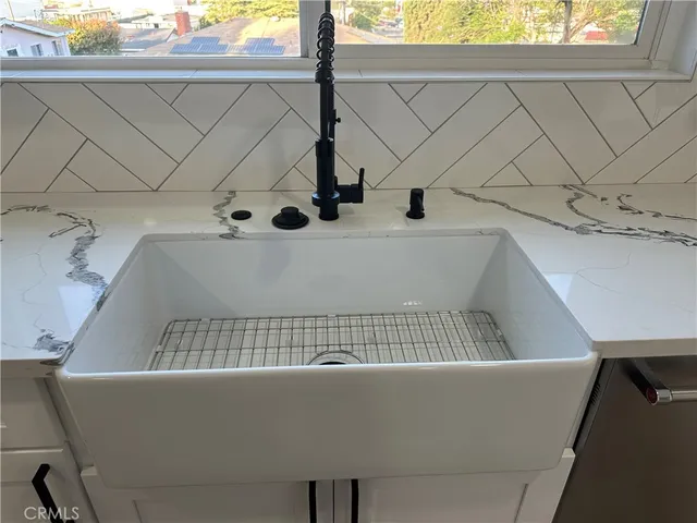 an empty room with wooden floor and closet