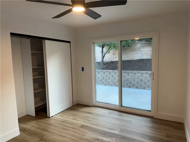 a kitchen with granite countertop a sink stove and cabinets