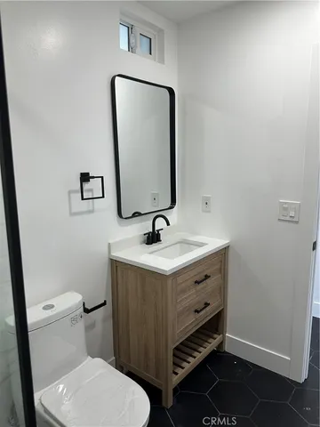 a bathroom with a shower and a toilet
