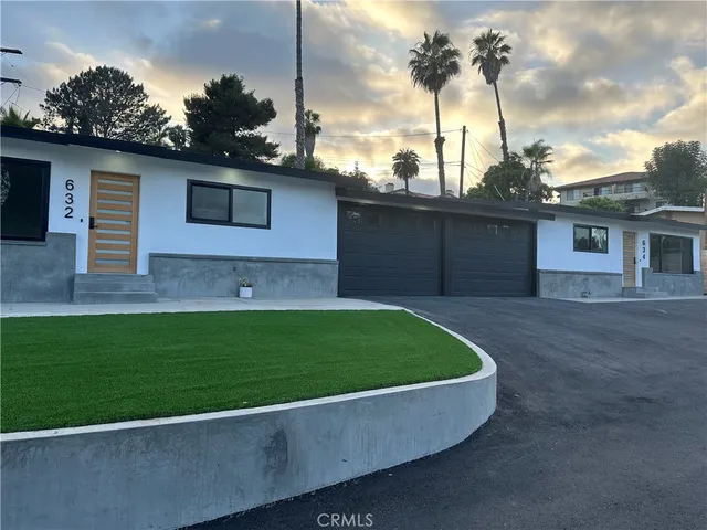 a bathroom with a tub and window