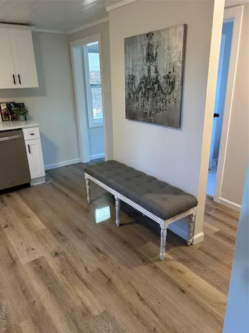 a room with wooden floor and furniture