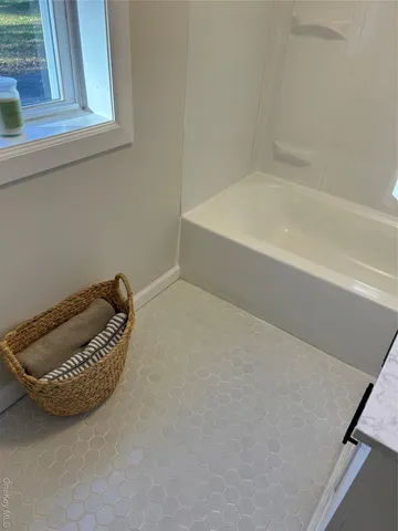 a room with a bed and a window