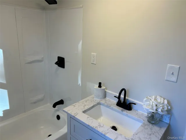 a bathroom with a sink and a tub