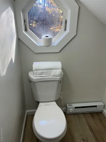 a bathroom with a toilet and a sink