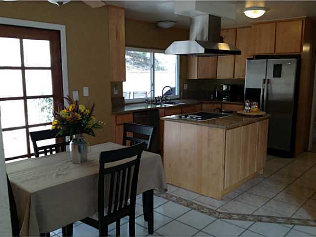 399 Compass Road Oceanside, CA 92054 - Photo 12 of 24 Kitchen and breakfast room opens to the family room and back yard
