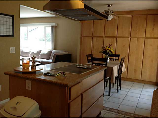 399 Compass Road Oceanside, CA 92054 - Photo 15 of 24 View from kitchen looking to the breakfast room and family room.