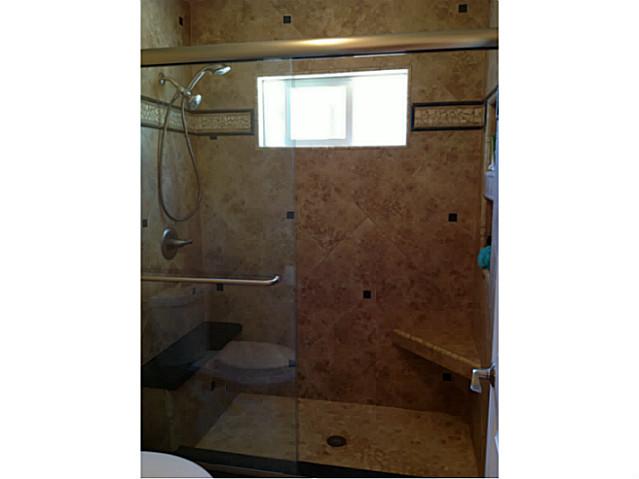 399 Compass Road Oceanside, CA 92054 - Photo 18 of 24 Walk in shower with a seat.