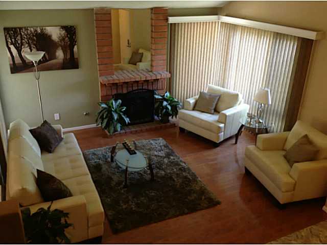 399 Compass Road Oceanside, CA 92054 - Photo 3 of 24 Looking into the living room with a brick fireplace