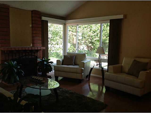 399 Compass Road Oceanside, CA 92054 - Photo 4 of 24 Spacious living room with plenty of windows for natural light.