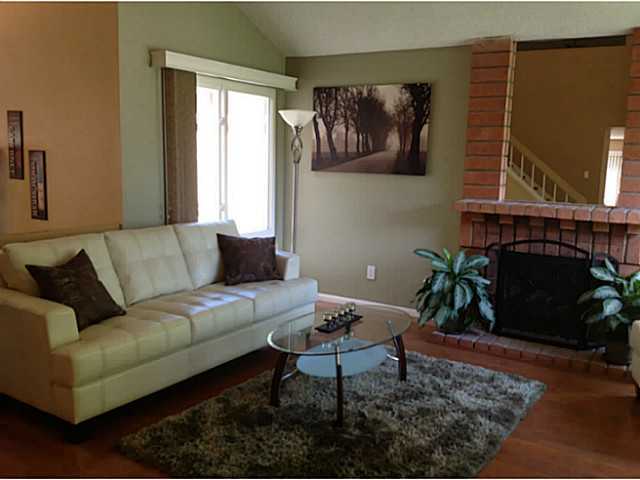 399 Compass Road Oceanside, CA 92054 - Photo 5 of 24 Brick fireplace in the living room vaulted ceilings.