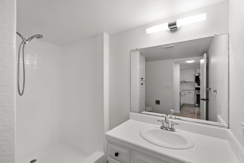 1313 Vía Tornasol Aptos, CA 95003 - Photo 20 of 38 a bathroom with a sink and a mirror