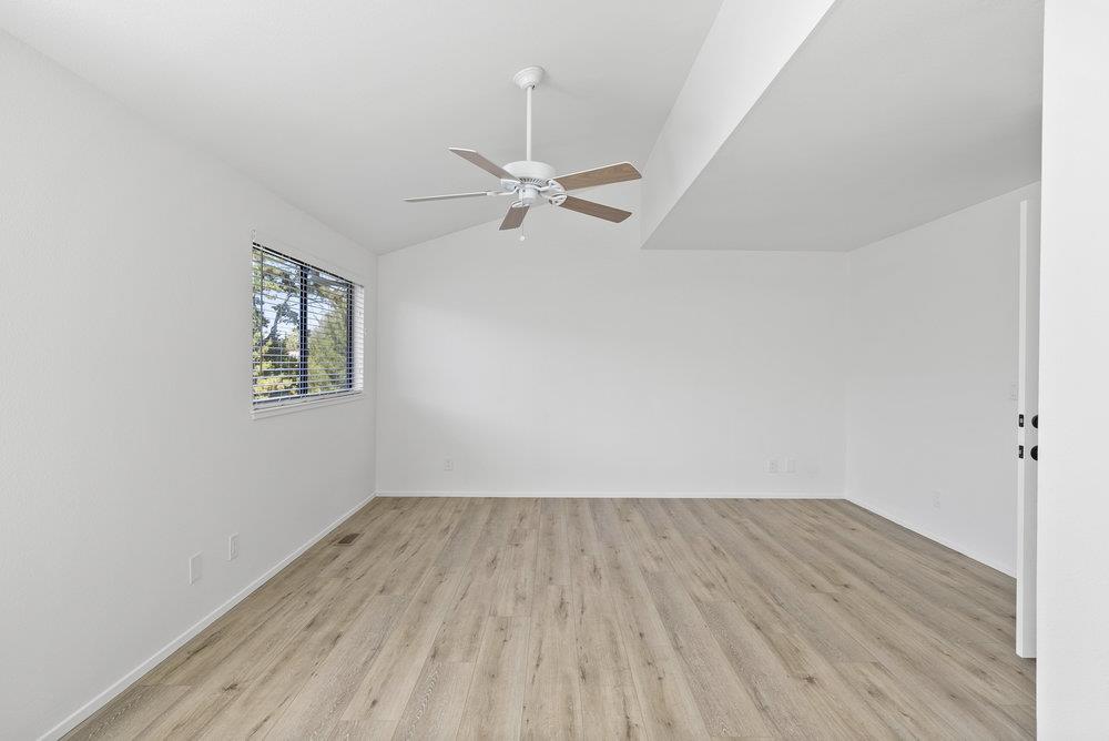 1313 Vía Tornasol Aptos, CA 95003 - Photo 23 of 38 a view of room with hardwood floor and a ceiling fan
