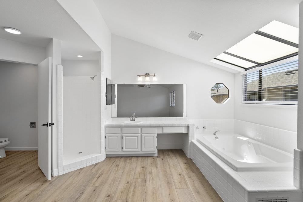 1313 Vía Tornasol Aptos, CA 95003 - Photo 27 of 38 a bathroom with a bathtub and a sink