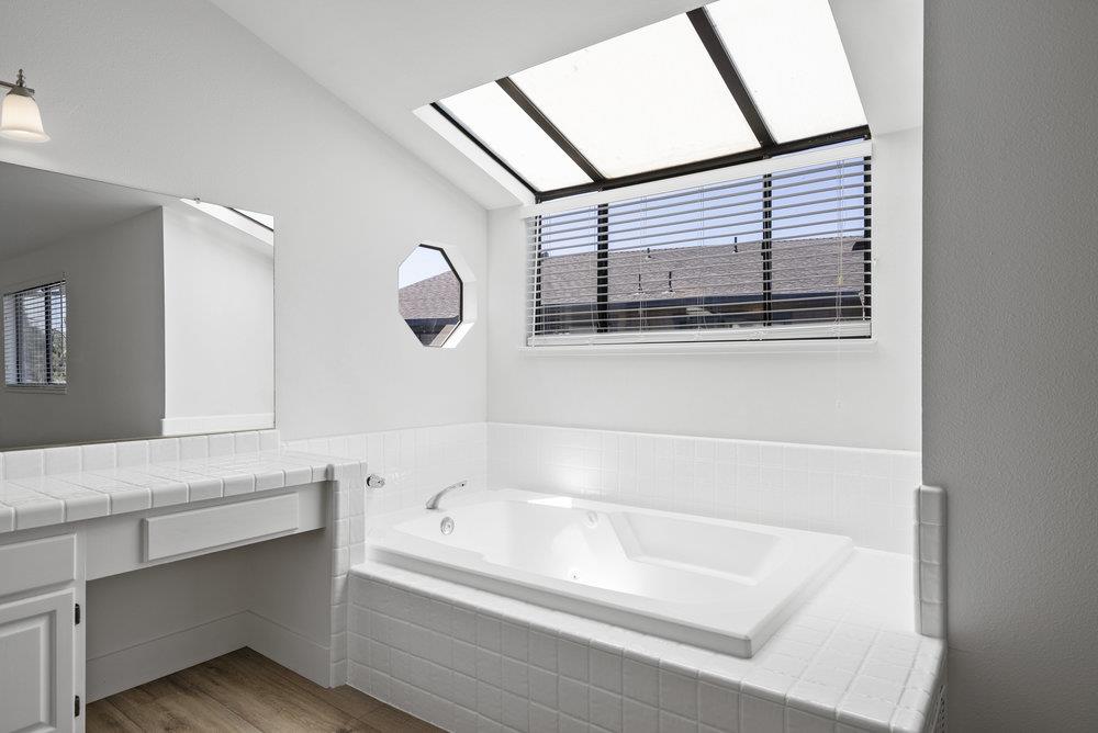 1313 Vía Tornasol Aptos, CA 95003 - Photo 28 of 38 a bathroom with a bathtub and a shower