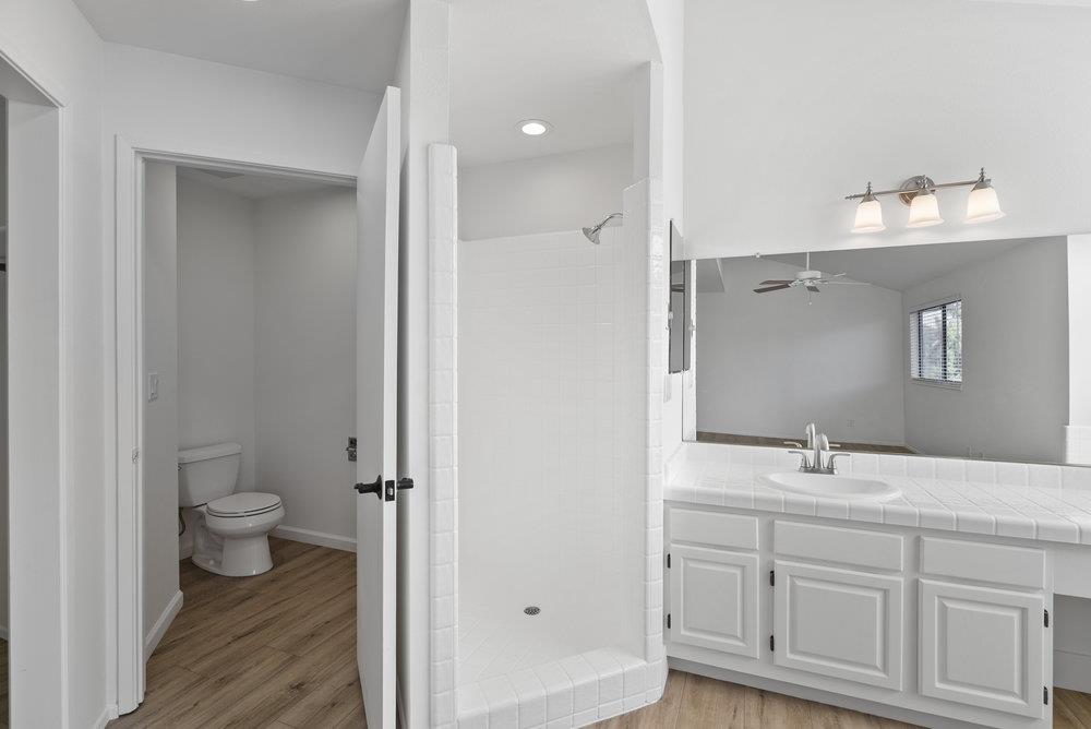 1313 Vía Tornasol Aptos, CA 95003 - Photo 29 of 38 a bathroom with a toilet sink and mirror