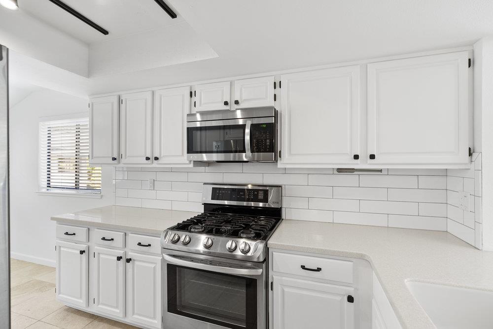 1313 Vía Tornasol Aptos, CA 95003 - Photo 9 of 38 a kitchen with appliances a sink and cabinets