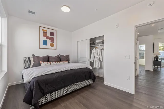 a bedroom with a bed and a view of bathroom