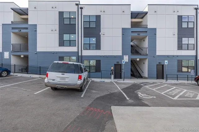 a car parked in front of a building