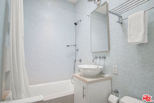 a bedroom with a bed and chair