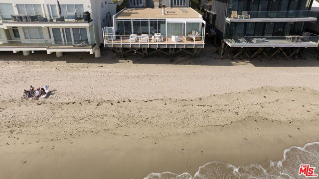 a view of a large building with a yard