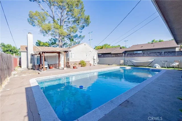 a view of a swimming pool with a patio