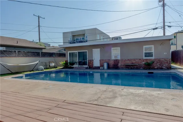 a kitchen with stainless steel appliances granite countertop a sink a stove and a wooden floors