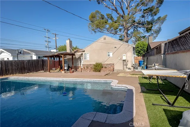 a view of a swimming pool with a patio