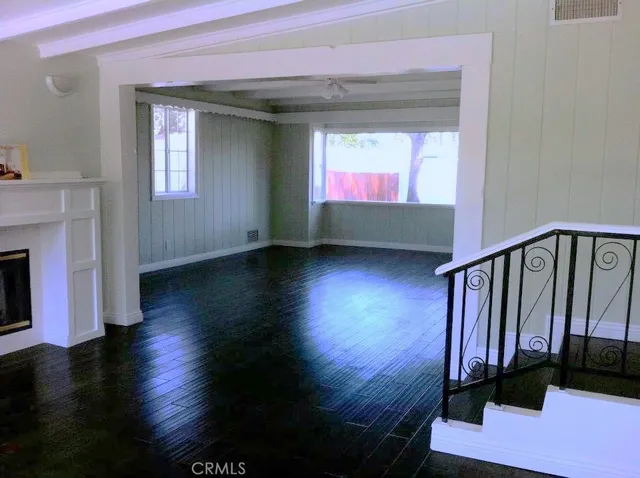 a view of an entryway with wooden floor