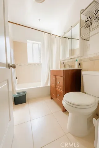 a bathroom with a sink a toilet and bathtub