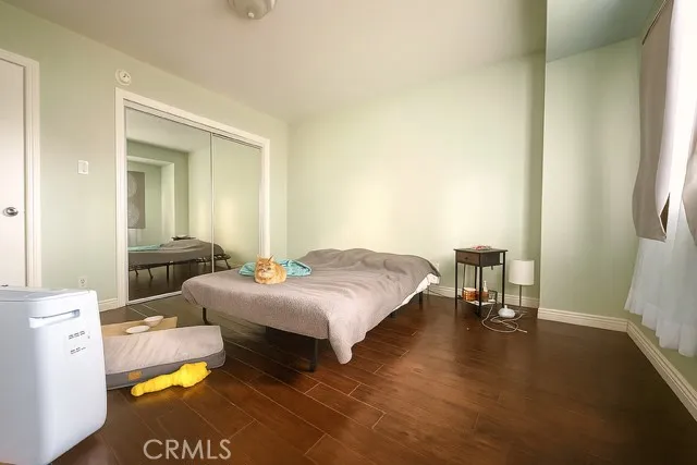 a bedroom with a bed and a table