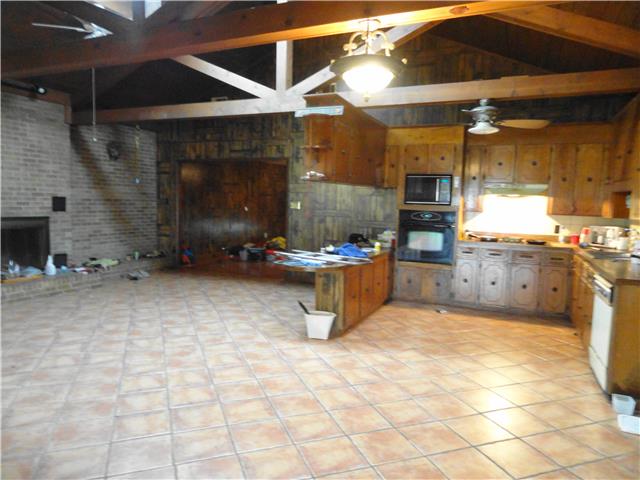 63 Overnack Road Lawrenceburg, TN 38464 - Photo 5 of 20 Great Room with Fireplace and Eat-In Kitchen comes with all the appliances you see in picture.