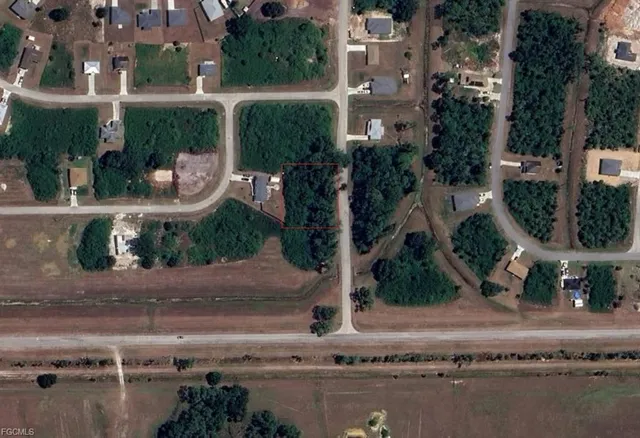 an aerial view of a house with outdoor space
