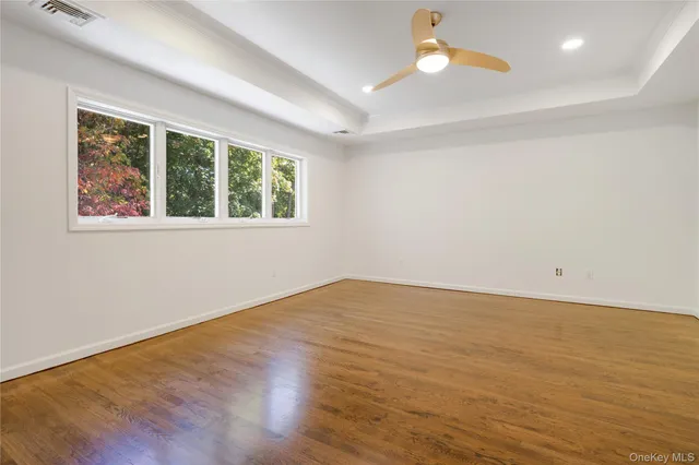 a bathroom with a granite countertop toilet a sink and a mirror